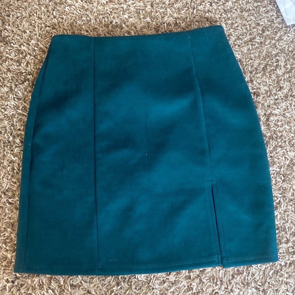 Green skirt with slit in the front